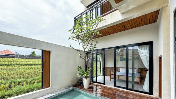 A modern villa with a swimming pool, wooden flooring, and a balcony overlooking a rice field. - 2-bedroom Villa Athaya in peaceful Bali (Bali)