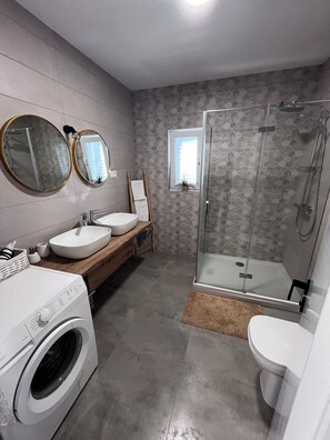 Shower, hair dryer, towels, soap