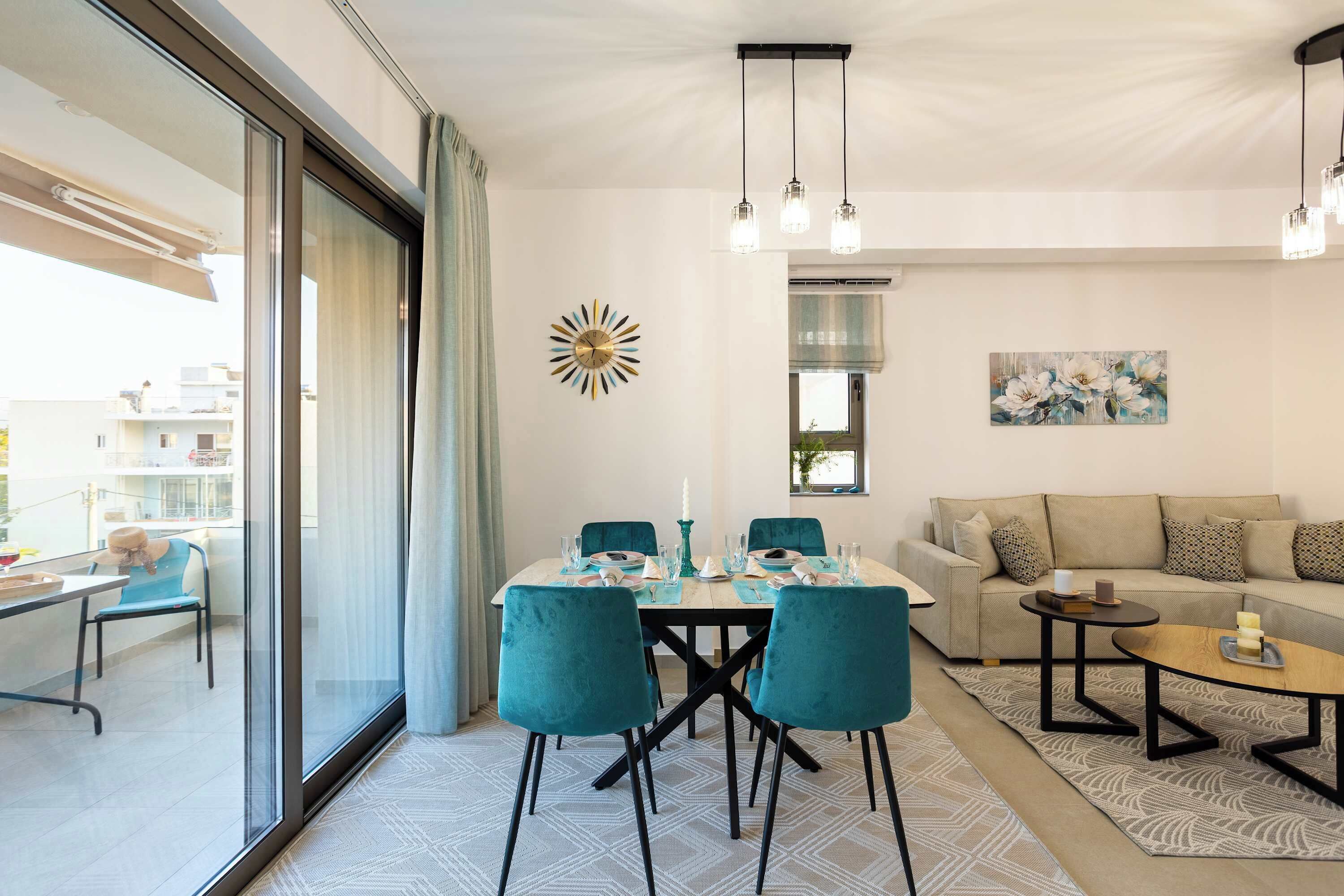 A modern living room with a dining area, a sofa, and a coffee table.