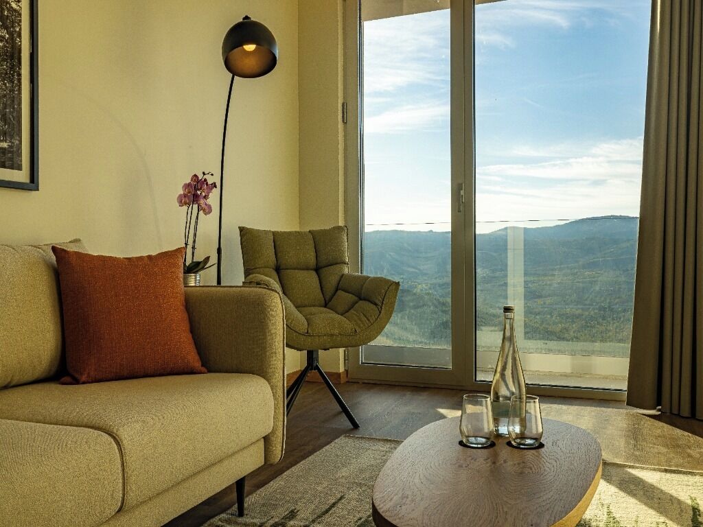 Junior Suite | Living area | 80-cm flat-screen TV with cable channels