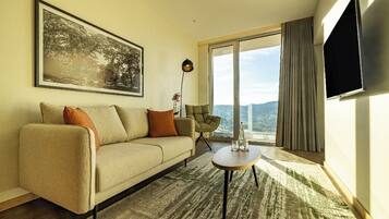 Junior Suite | Living area | 80-cm flat-screen TV with cable channels