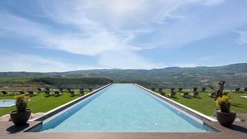Indoor pool, outdoor pool, open 9:00 AM to midnight, pool umbrellas