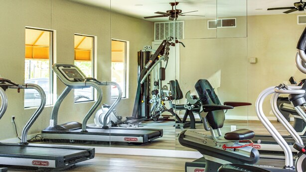 A gym with multiple treadmills, exercise bikes, and weight machines. - Unwind Poolside! Condo 1 Mi to South Mountain Park (Phoenix)