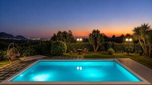 A rectangular swimming pool with a clear blue water surface, surrounded by a paved deck. - Ktima KiKa - Private Pool Escape & Tranquility (Memi)