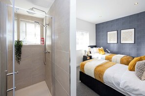 Shower, hair dryer, towels, shampoo