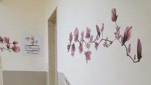 A staircase with a wooden finish and a wall with a floral mural. - Cilento sea and history - Double (San Marco)