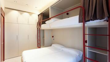 A bunk bed room with a wardrobe and a ladder.
