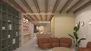 A modern lobby with a front desk, seating area, and bookshelves. - The Central House Valencia Mercado Central (Valencia)