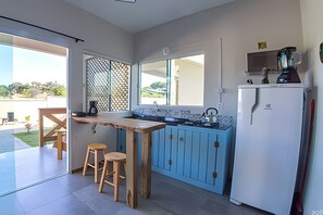 Microwave, cookware/dishes/utensils, cleaning supplies