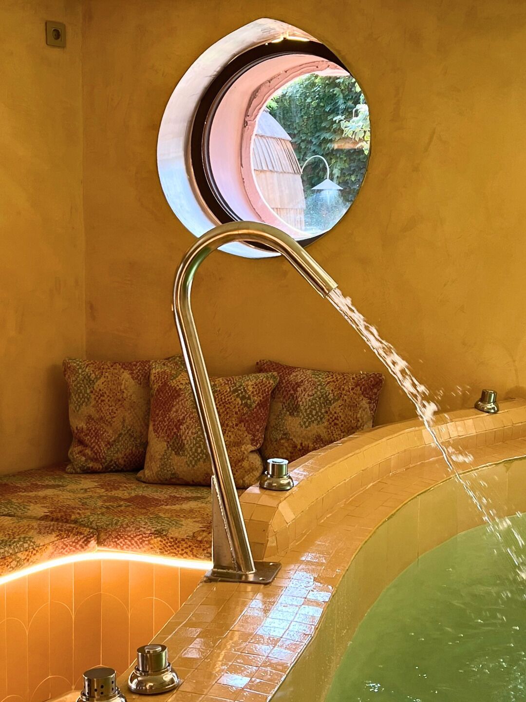 A bathroom with a bathtub, a mirror, and a sink.