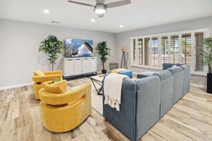 TV, fireplace, books, offices