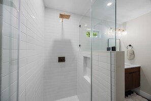 Shower, hair dryer, towels, toilet paper