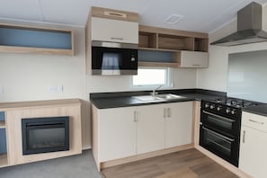 Cottage | Private kitchen | Cookware/dishes/utensils - Lyons Sunnysands Holiday Park - Holiday Accommodation 13733 (Talybont)