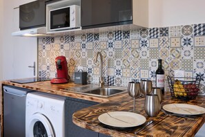 Fridge, microwave, toaster, cookware/dishes/utensils