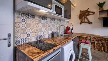 Fridge, microwave, toaster, cookware/dishes/utensils