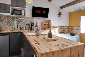 Fridge, microwave, toaster, cookware/dishes/utensils