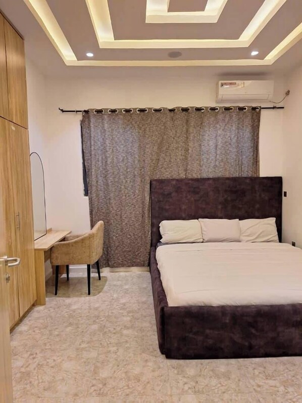 Economy Apartment, Balcony, City View | Desk, laptop workspace, blackout drapes, soundproofing