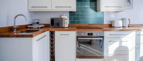 Apartamento (1 Bedroom) | Cocina privada | Microondas, horno, placa de cocina y lavavajillas