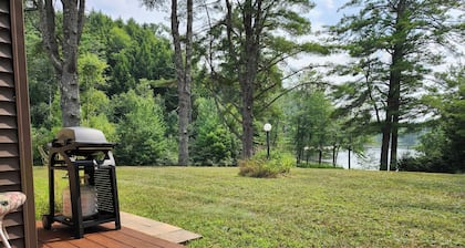 Lakefront townhome on Tripp Lake in the Adirondacks, minutes from Gore Mountain skiing, Lake George, hiking, kayaking, and year-round outdoor adventure.