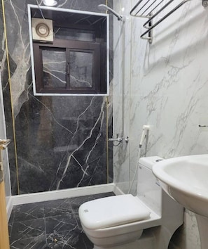 Shower, hair dryer, slippers, towels