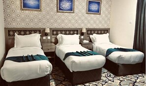 Deluxe Triple Room | In-room safe, desk, blackout drapes, soundproofing