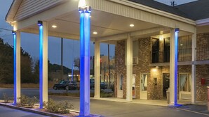 A gas station with a covered canopy and multiple fuel pumps. - Best Inn of Manning (Manning)