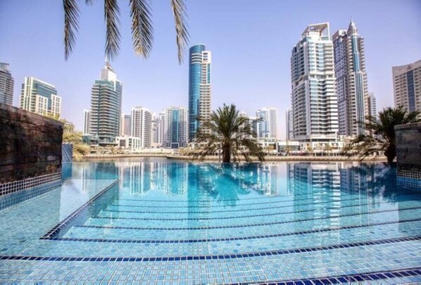 2 outdoor pools, pool umbrellas, pool loungers
