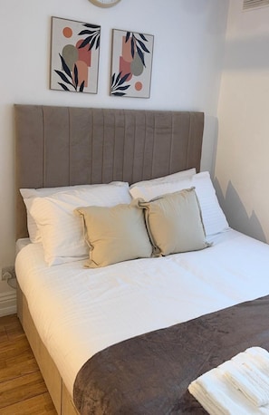 Hypo-allergenic bedding, desk, laptop workspace, blackout curtains