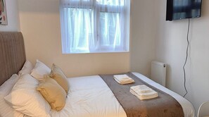 Hypo-allergenic bedding, desk, laptop workspace, blackout curtains
