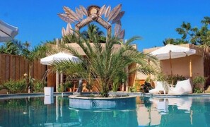 Outdoor pool, pool umbrellas, sun loungers