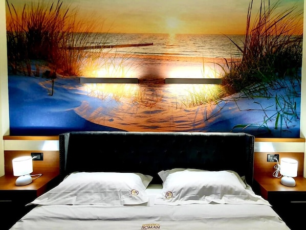 Deluxe-huoneisto, parveke | Työpöytä, ilmainen Wi-Fi, vuodevaatteet