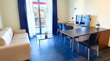 Deluxe Apartment, Balcony | Living area