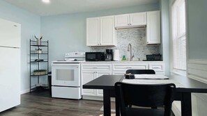 Fridge, stovetop, coffee/tea maker, cookware/dishes/utensils