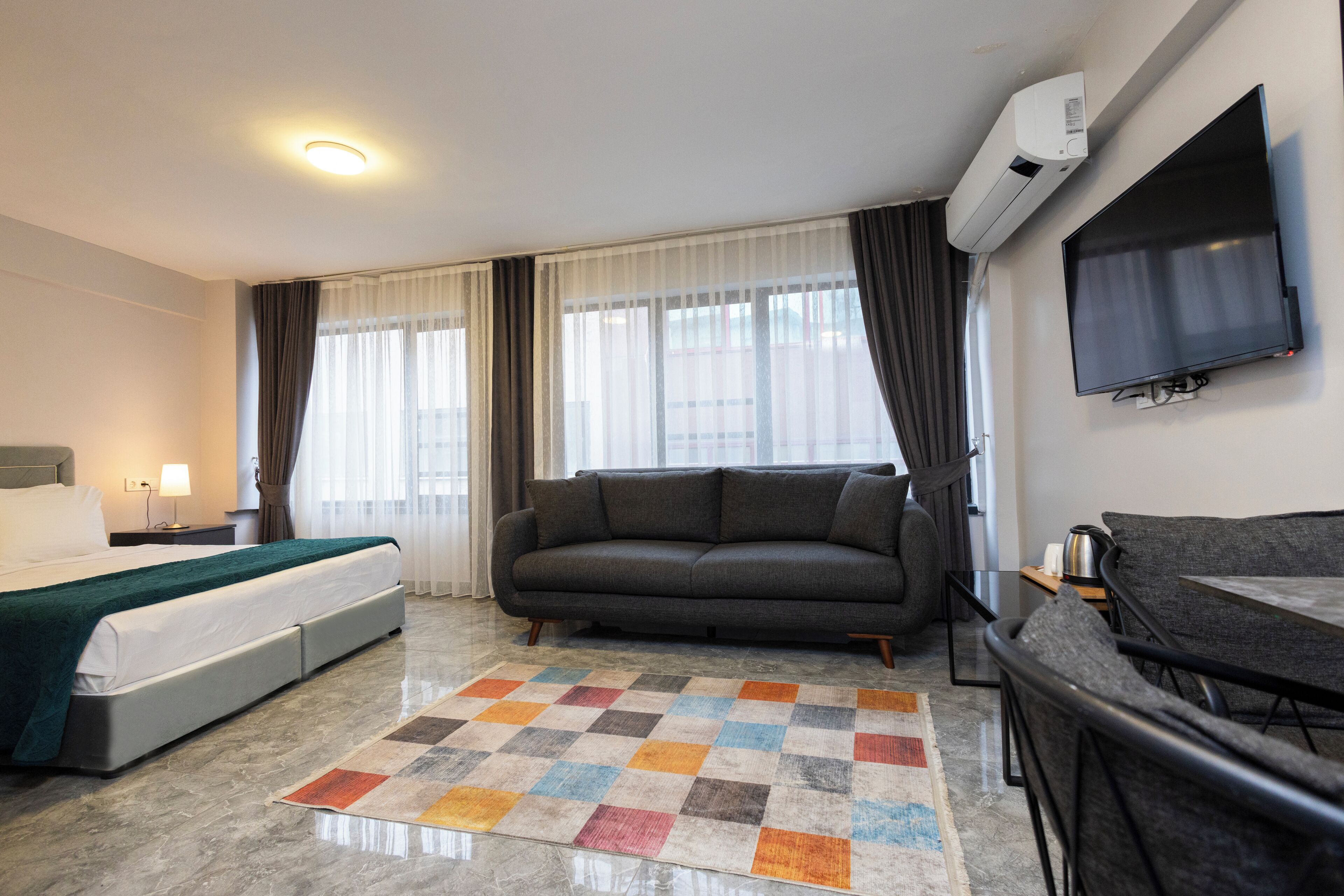 Standard Studio | Desk, laptop workspace, blackout drapes, iron/ironing board