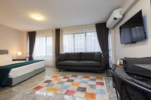 Desk, laptop workspace, blackout curtains, iron/ironing board