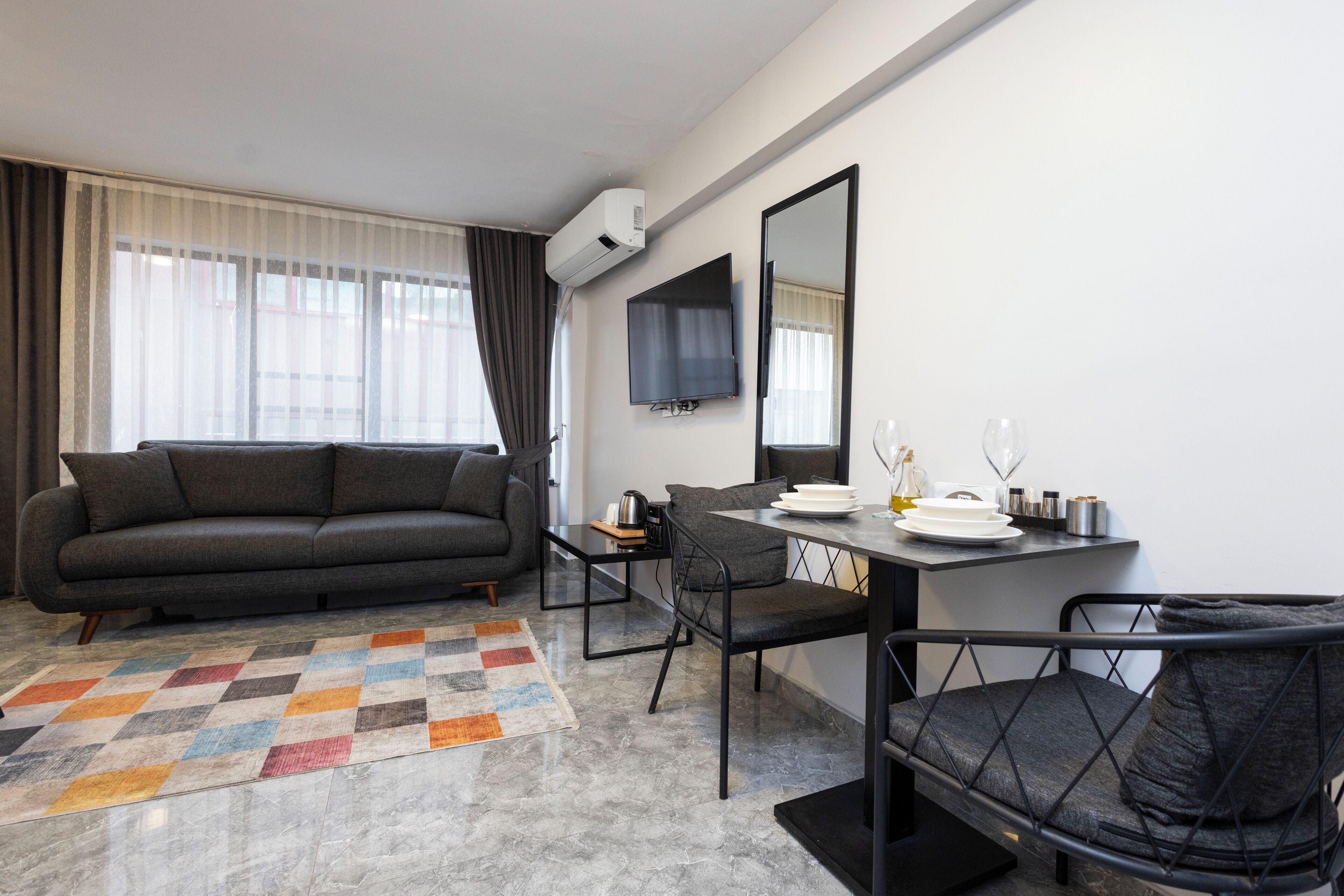 Standard Studio | Desk, laptop workspace, blackout drapes, iron/ironing board