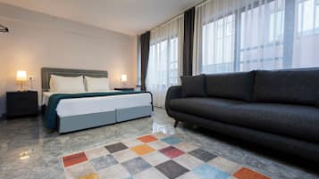 Standard Studio | Desk, laptop workspace, blackout drapes, iron/ironing board