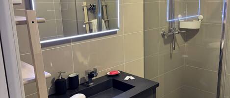 Shower, hair dryer, towels, soap