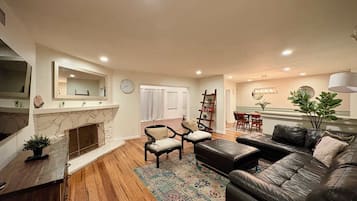 TV, fireplace, books, offices