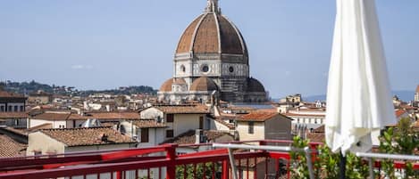 A view of a dome structure, likely a historical building, with surrounding urban architecture.