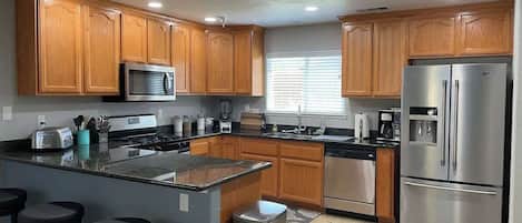 Coffee/tea maker, fridge, microwave, oven