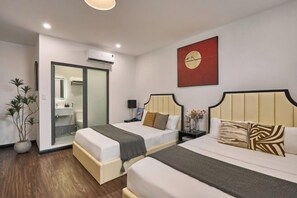 A hotel room with two beds, a bathroom, and a large mirror. - Venus Secret Hotel Aeon Bình Tân (Ho Chi Minh City)