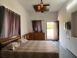 Kamar Deluks, AC, pemandangan kebun | Meja kerja dan Wi-Fi gratis