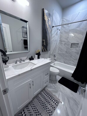 Shower, hair dryer, towels, soap