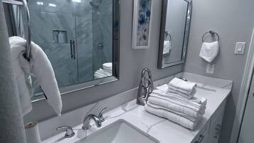 Shower, hair dryer, towels, soap