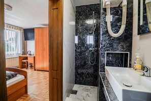 Shower, hair dryer, towels