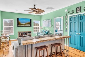 TV, fireplace - Relax & Play: Beach, Pools & Arcade Awaits (Gulf Shores)