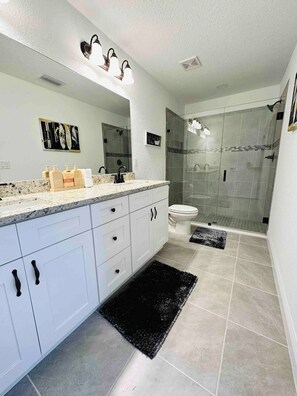 Shower, hair dryer, towels, soap