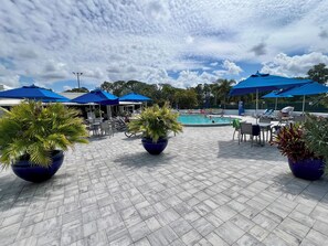Outdoor pool, a heated pool - WORLD TENNIS CLUB & SPA.  RESORT STYLE LIVING - EAT, DRINK AND BE MERRY (Naples)