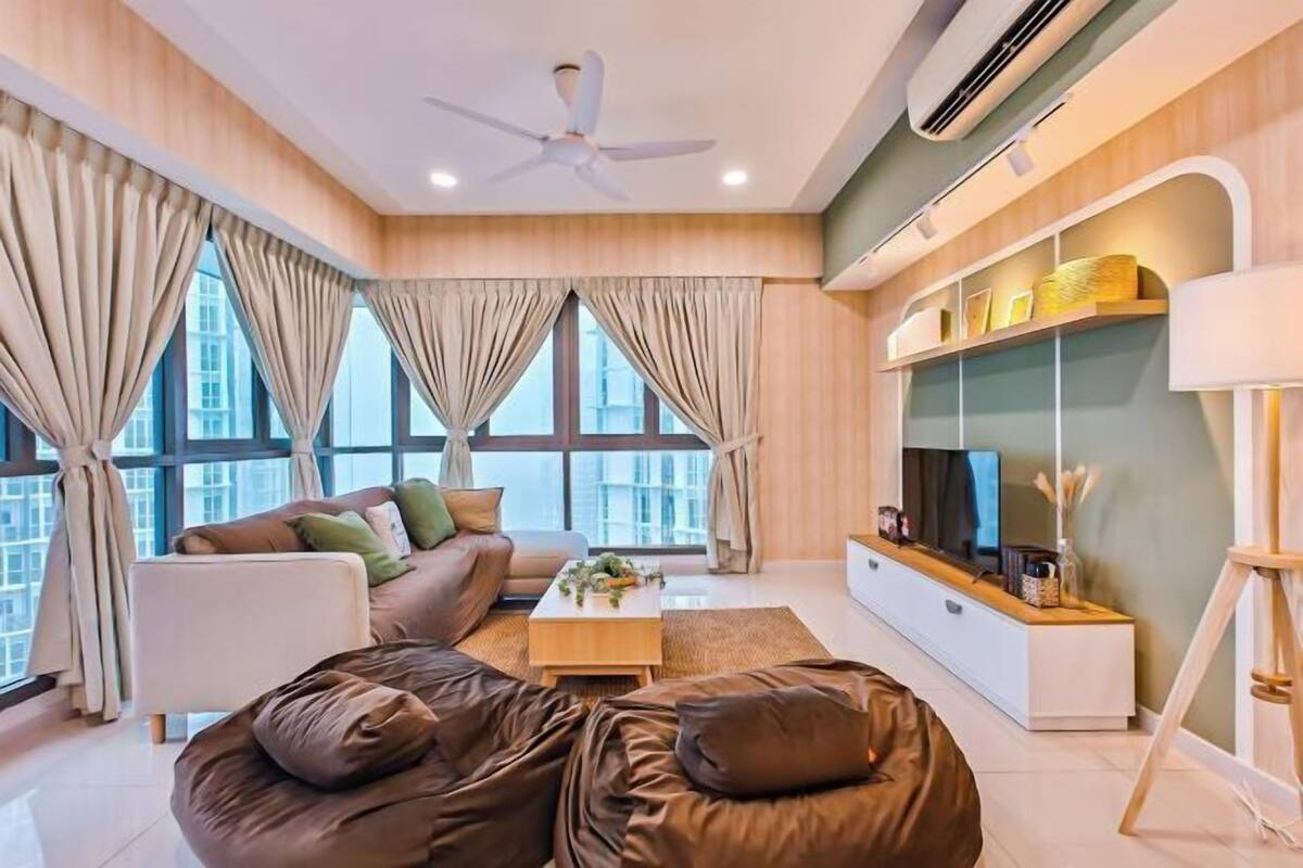 A modern living room with a sofa, coffee table, and TV.